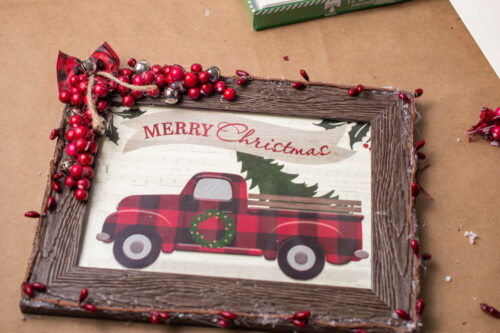 A merry christmas frame with a truck on it.
