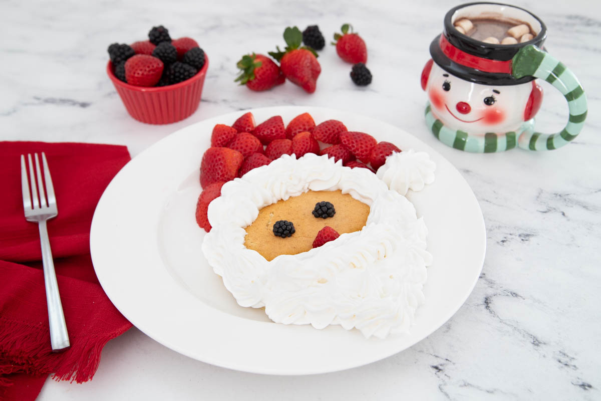 A white plate with a santa claus on it.