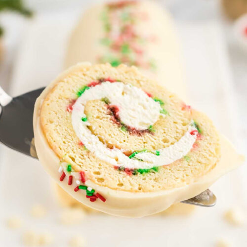 A christmas roll being held up by a spatula