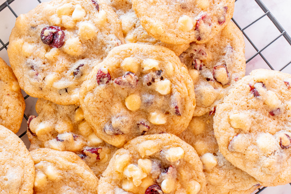 Cranberry white chocolate chip cookies on a cooling rack.
