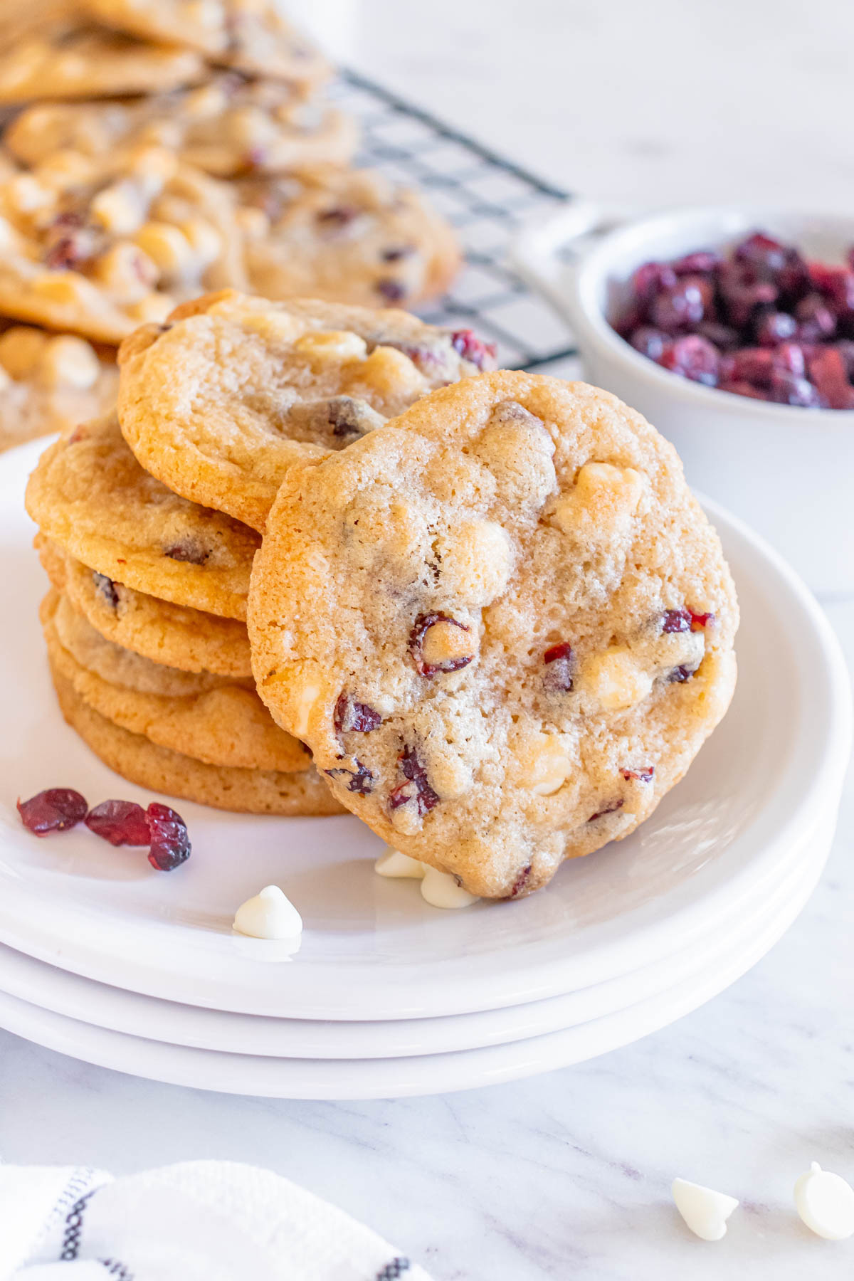 White chocolate cranberry cookies on a plate.
