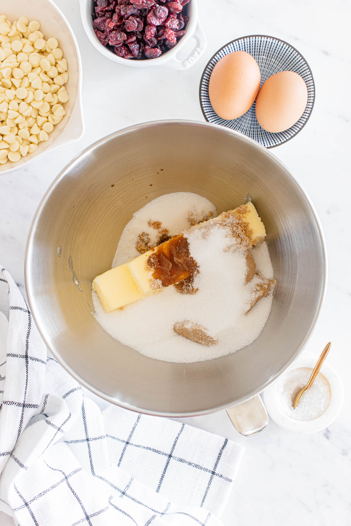 A mixing bowl with eggs, sugar and flour