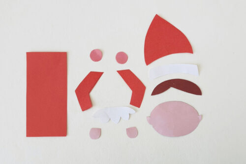Paper cut outs of elf pieces for a bookmark