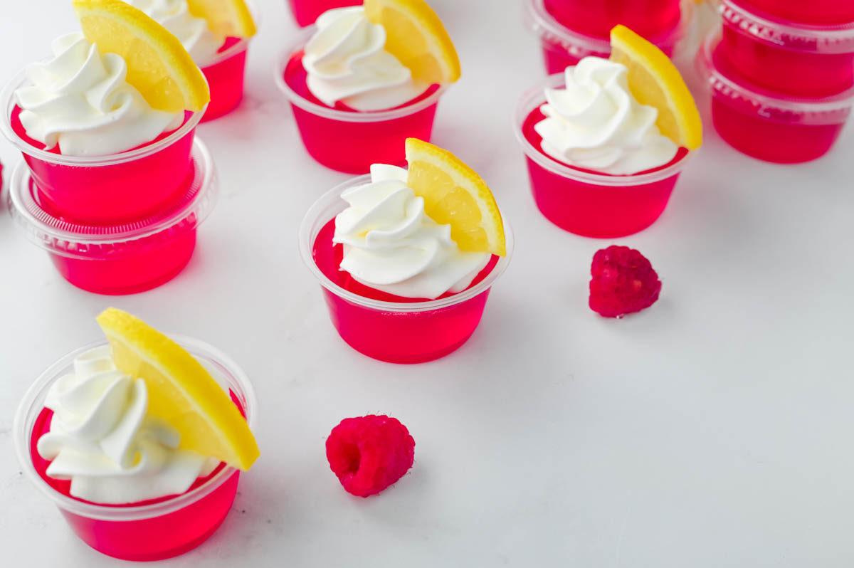 Raspberry lemonade cups with whipped cream and lemon slices