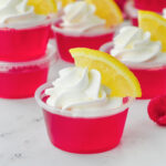 Jello shots with whipped cream and lemon slices