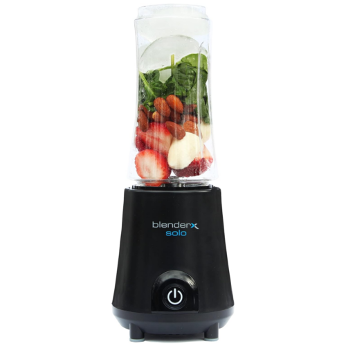 A blender filled with fruits and vegetables.