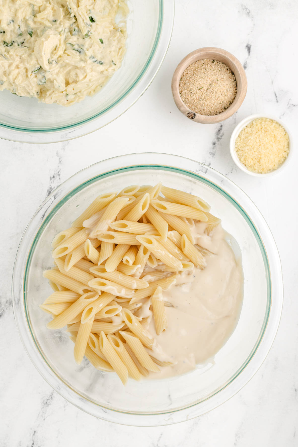 A bowl of pasta with alfredo sauce