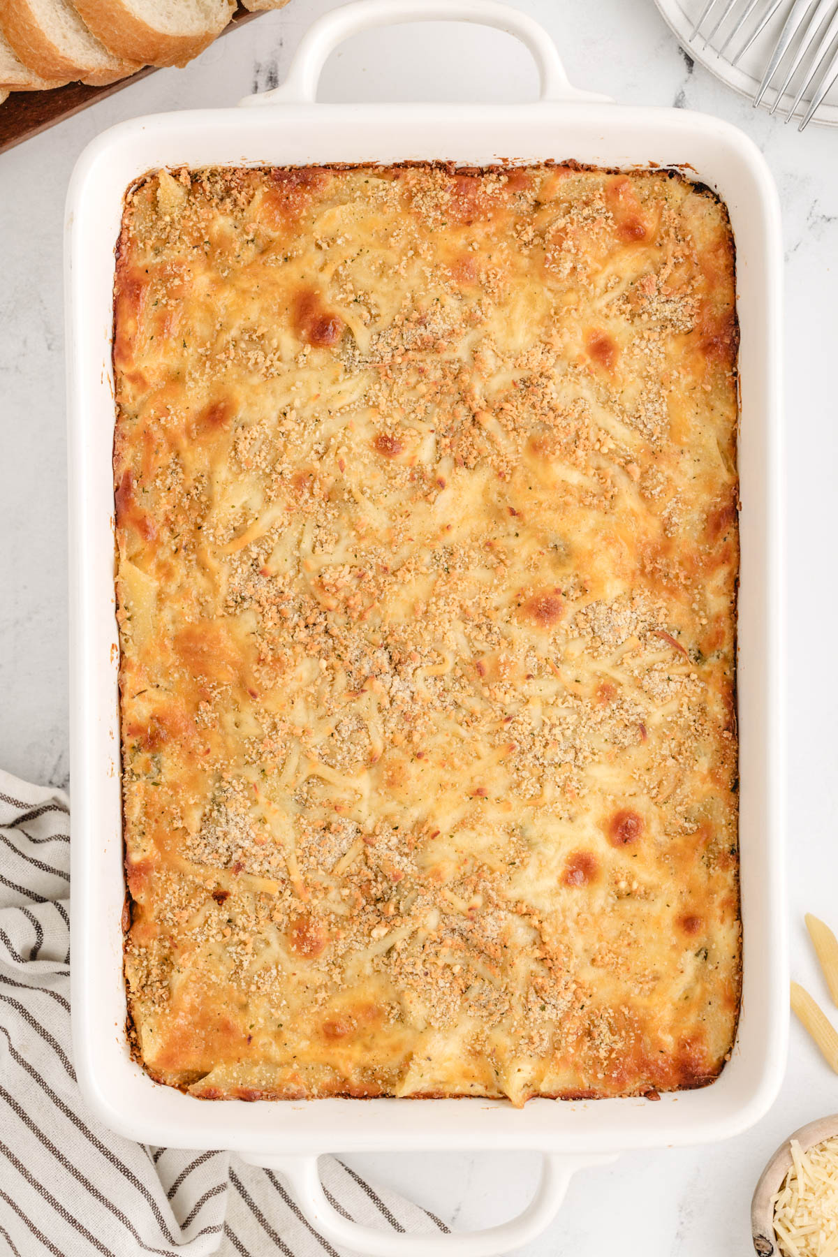 A casserole dish filled with a chicken alfredo bake