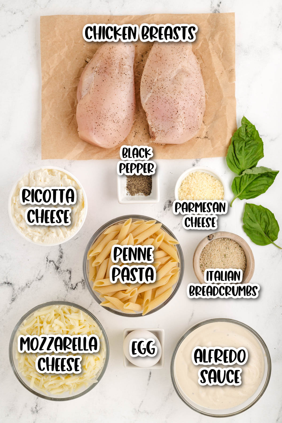 Chicken alfredo bake ingredients on marble counter