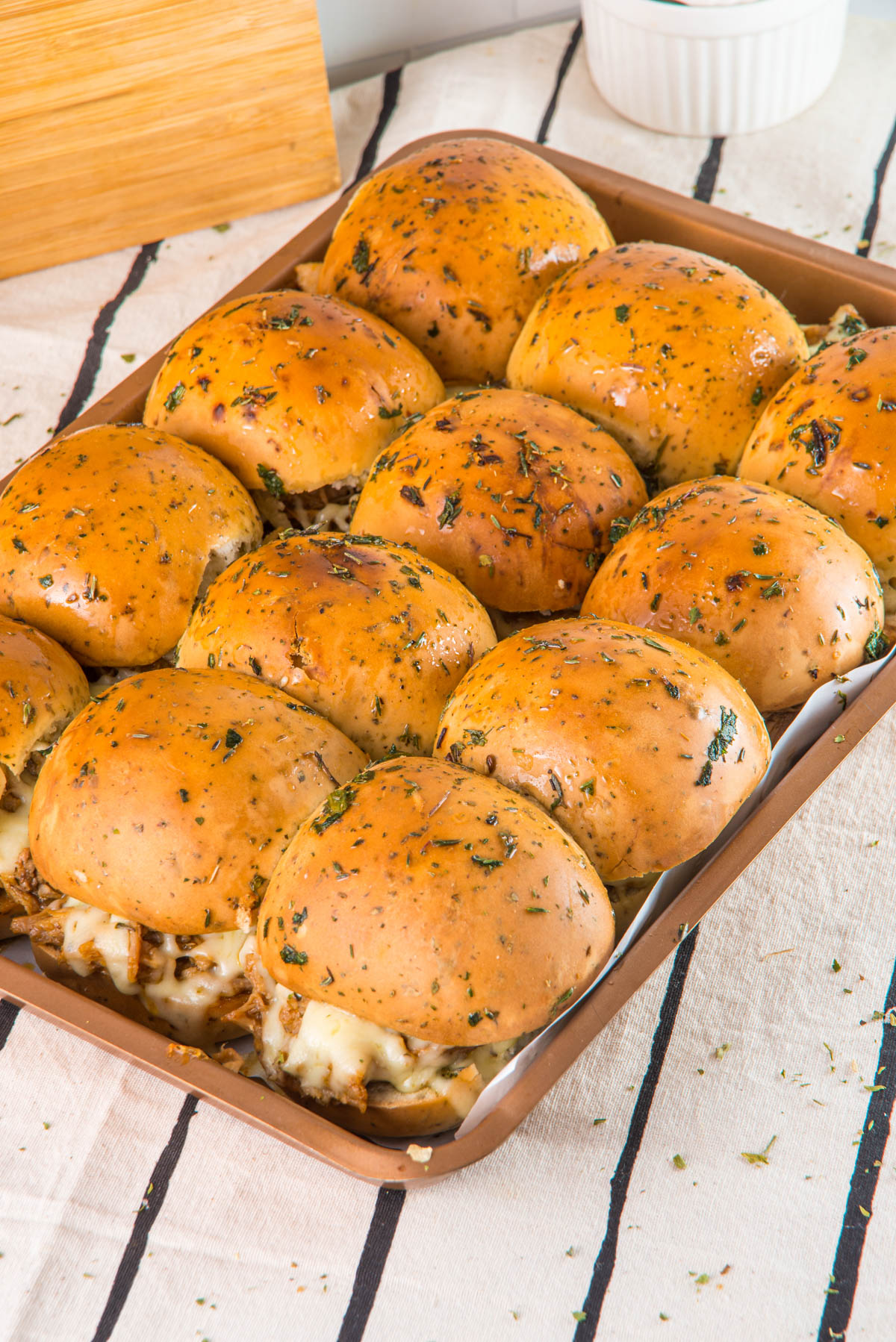 A pan filled with pork sliders
