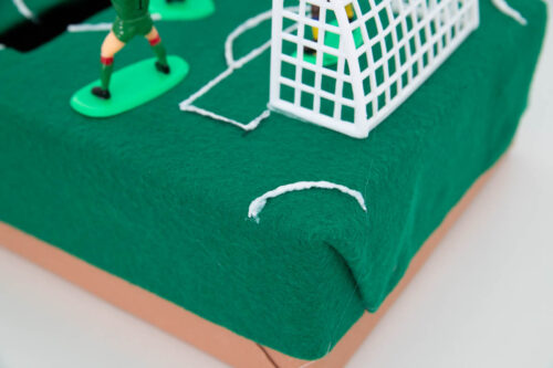 A green box with a soccer goal on top.