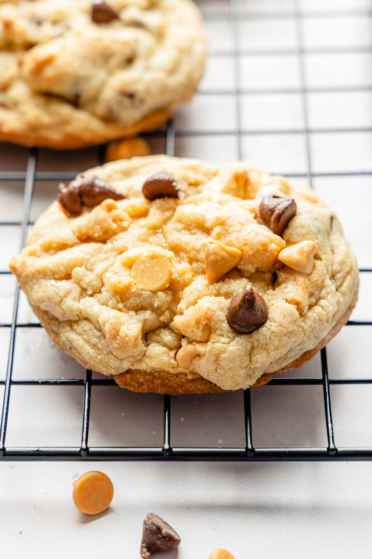Butterscotch chocolate chip cookies on a cooling rack.