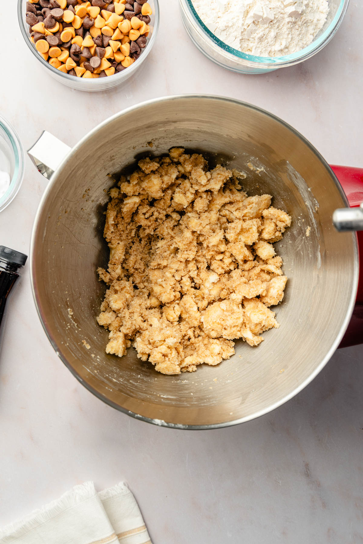 A mixing bowl full of ingredients for cookies