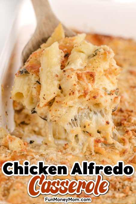 A close up of chicken alfredo bake on a wooden spoon