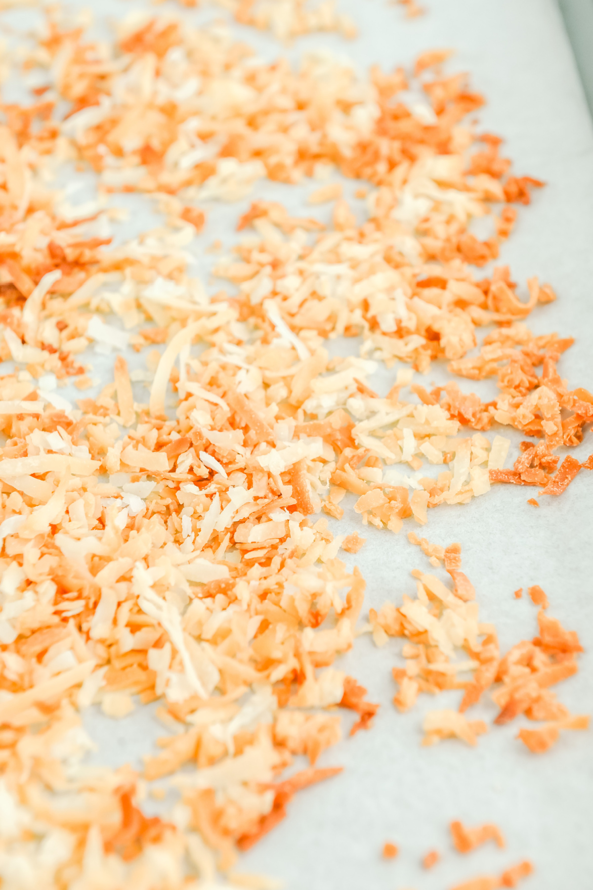 Toasted shredded coconut on parchment paper