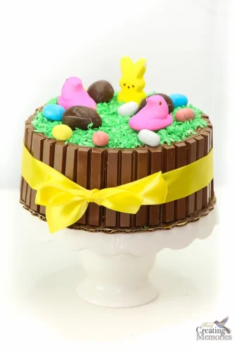 A chocolate cake decorated with easter peeps and bunnies.