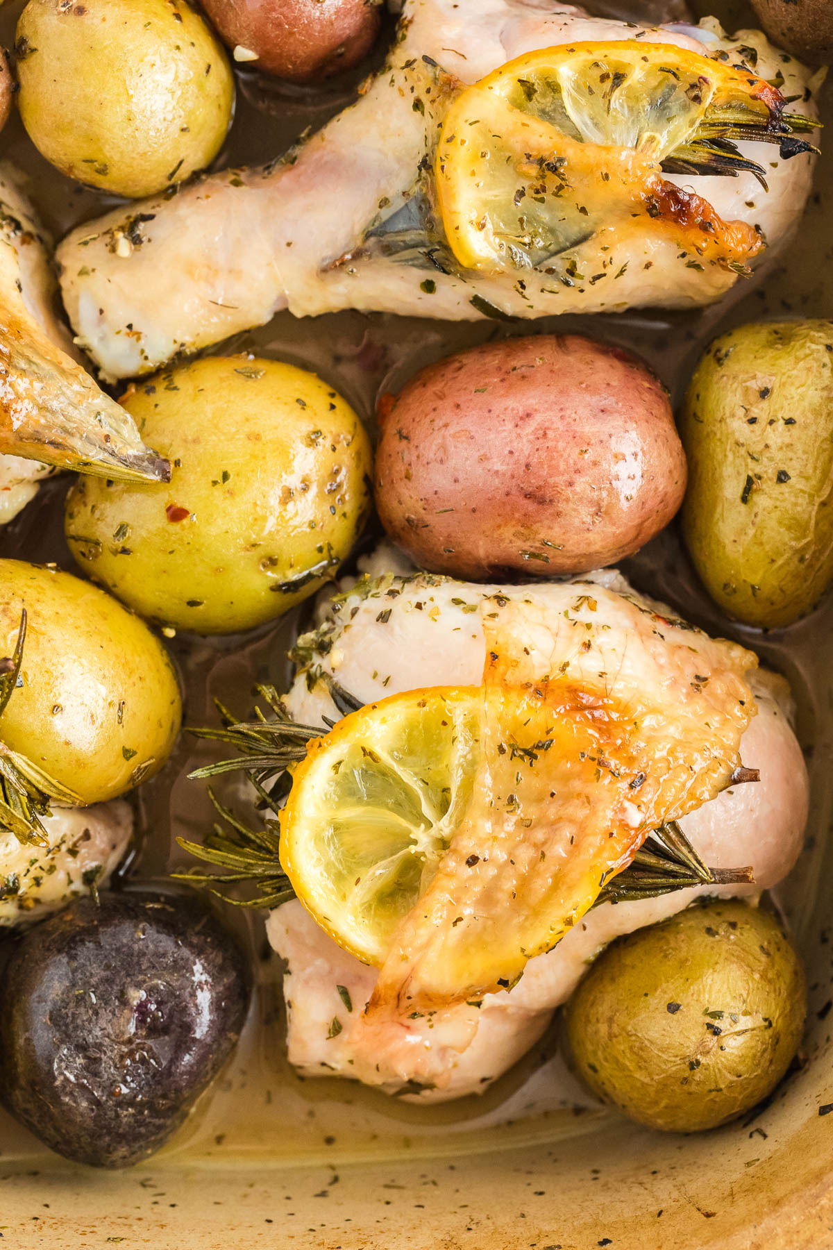 Roasted chicken with potatoes and lemons.