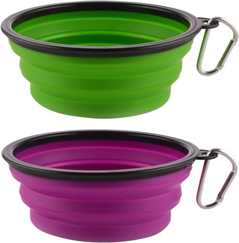 Two collapsible silicone bowls for dogs in green and pink with metal carabiners.