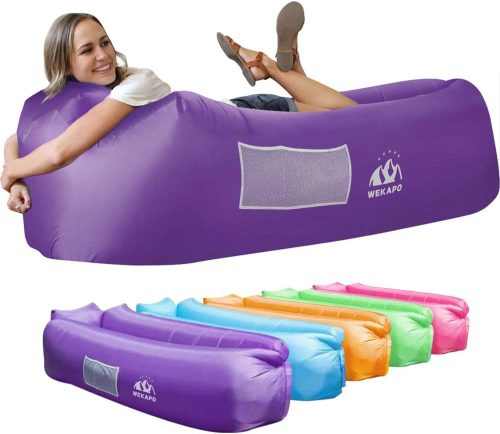 A smiling woman reclining on a purple inflatable lounger with images of additional loungers in various colors displayed below.