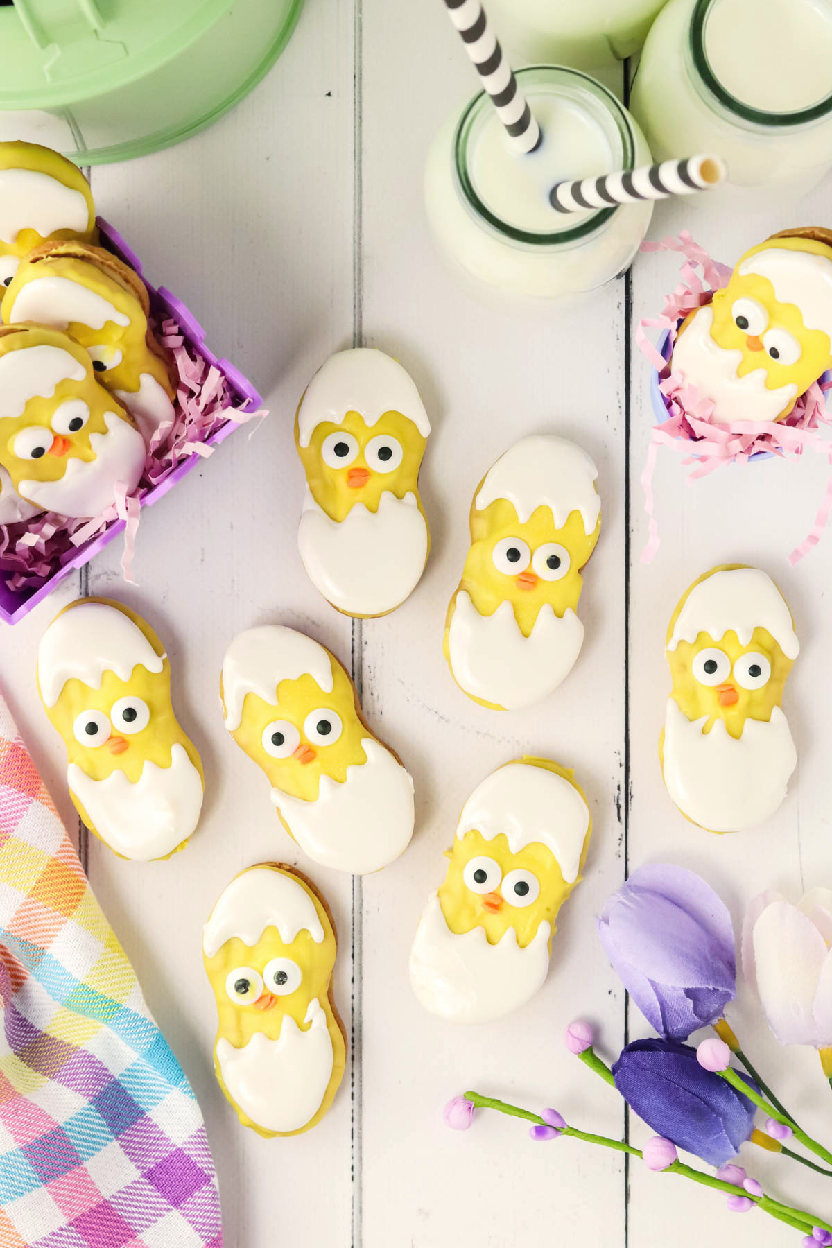 Easter cookies with flowers on a white table.