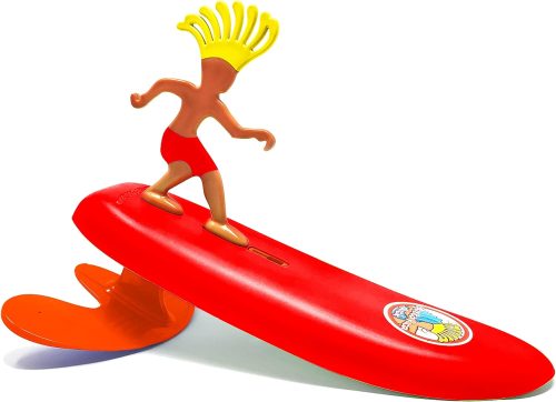 A toy figure of a character with raised arms and spiky hair surfing on a red plastic surfboard.