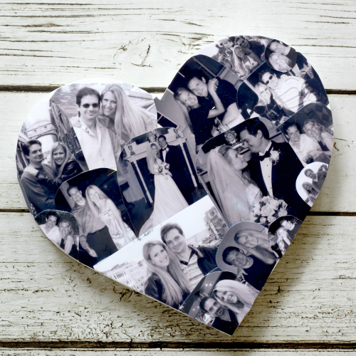 Heart-shaped collage of black and white wedding photos displayed on a wooden background.