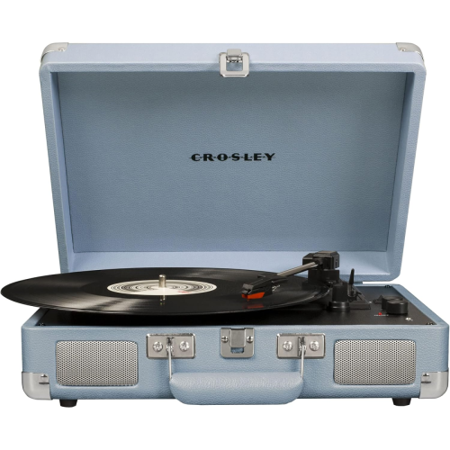 A light blue Crosley suitcase-style record player with an open lid, playing a black vinyl record.