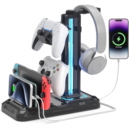 A black and blue gaming accessories stand holds two controllers, a headset, two smartphones, and a Nintendo Switch, with devices connected to charging ports.