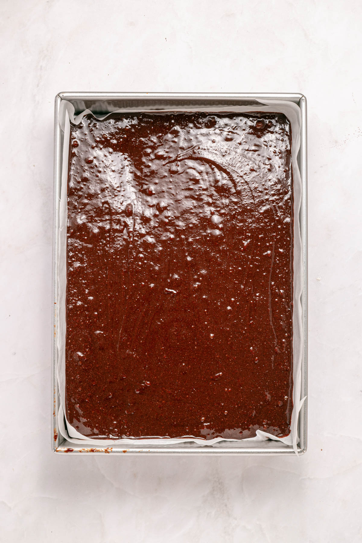 Brownie batter in a pan.