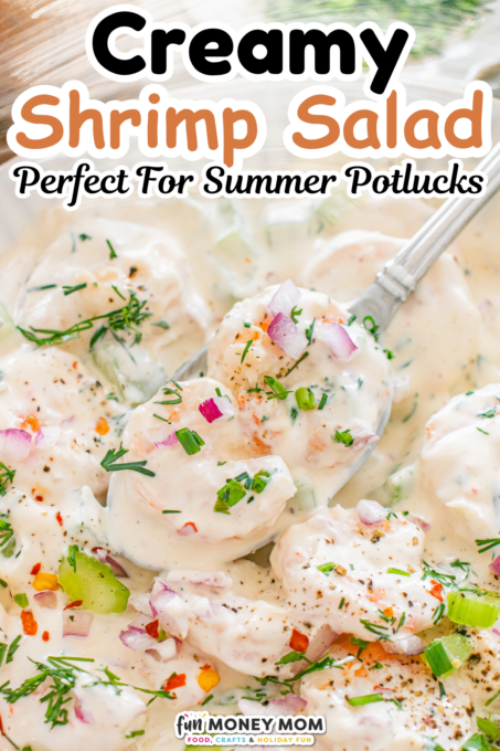 Creamy shrimp salad with red onion, celery, and dill, served on a spoon.
