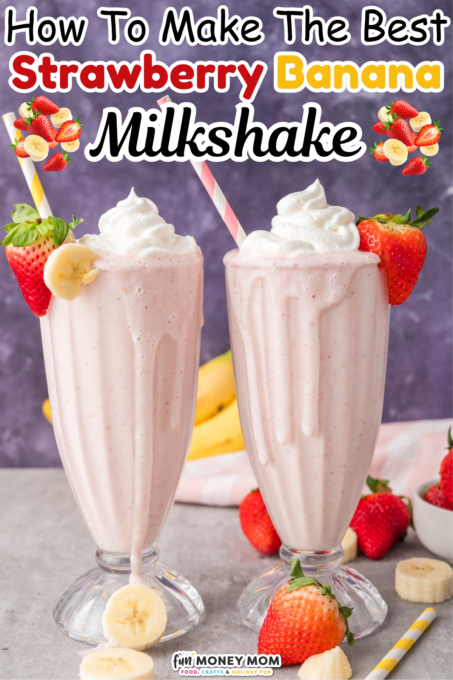 Two tall glasses of strawberry banana milkshake topped with whipped cream and straws, surrounded by fresh strawberries and banana slices.