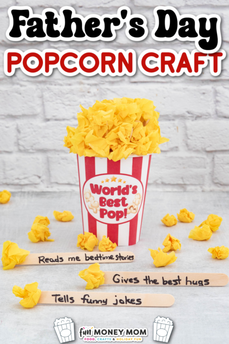 Striped popcorn container with "World's Best Pop!" label, filled with yellow paper popcorn, and three popsicle sticks with handwritten Father's Day messages in front.