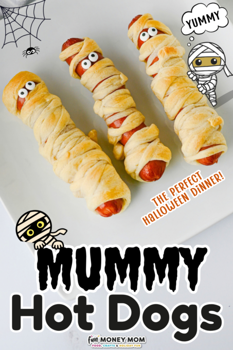 Three hot dogs wrapped in dough strips to look like mummies, with candy eyes, served on a plate with Halloween-themed text and illustrations.